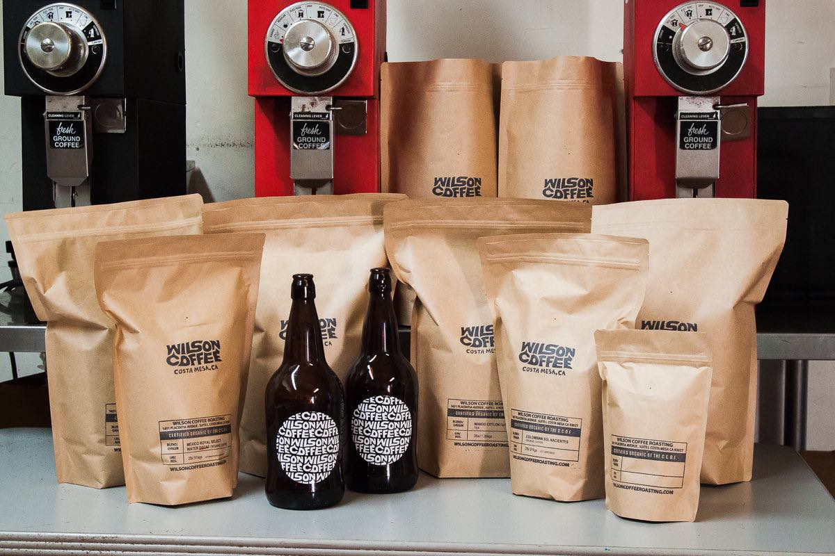 Bags of freshly roasted whole bean coffee, and bottles of cold-brew coffee, at Wilson Coffee in Costa Mesa, California.