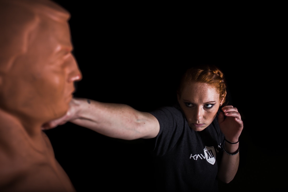 Krav Maga XD Instructor, Brooke Evans, demonstrates how to punch. // photo: @byoungforeverphotog