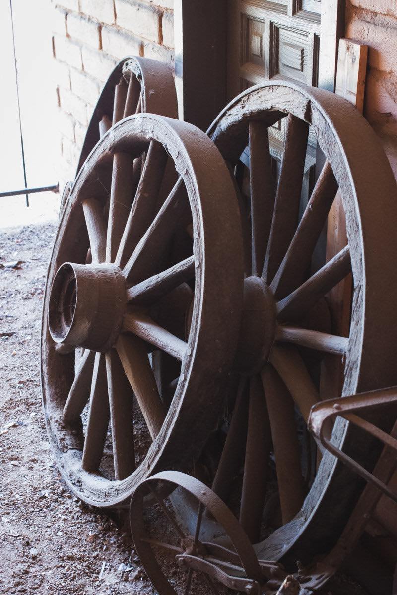 Wooden Wagon Wheels Lean Against A Door At The Diego Sepulveda Adobe At Estancia Park In Costa Mesa, California