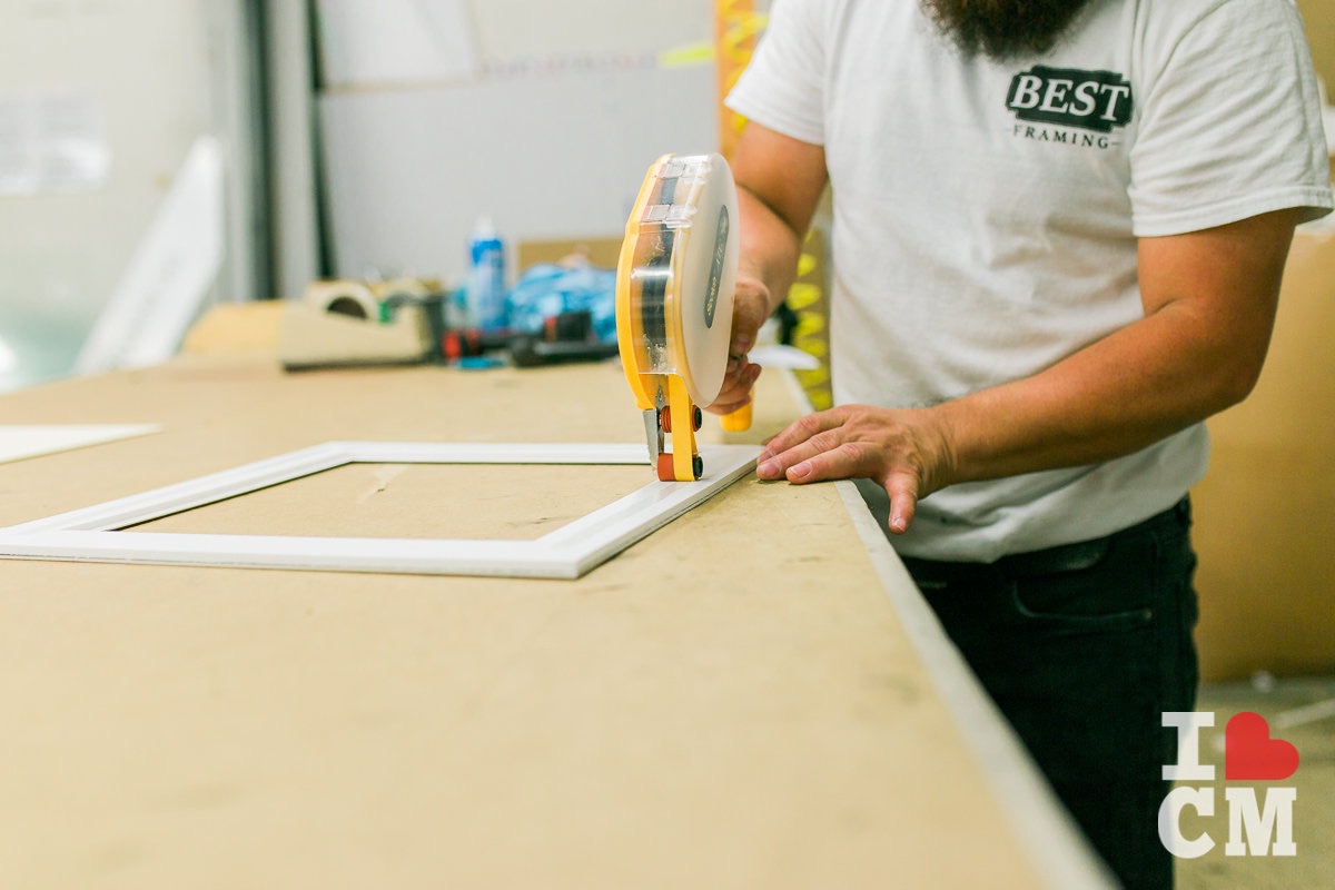 Adding Adhesive at Best Framing in Westside Costa Mesa, California