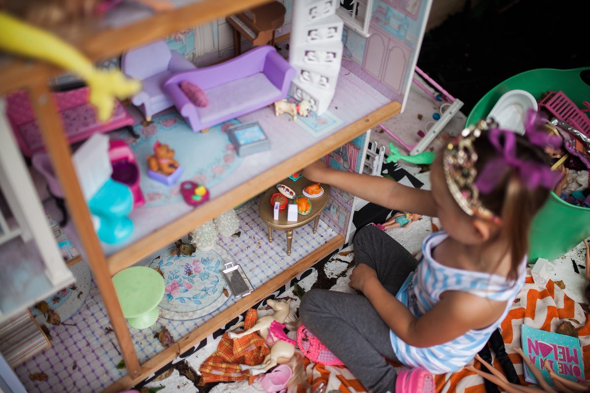 Girl in a Princess Crown playing with Dolls and a Dollhouse at Camp Lila, Mesa del Mar Costa Mesa