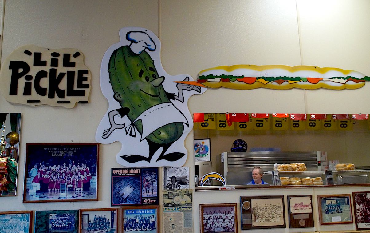 The Lil' Pickle is full of community spirit with its walls of old sports team photos and other memorabilia, not to mention its restaurant mascot - a pickle. (Photo: Bradley Zint)