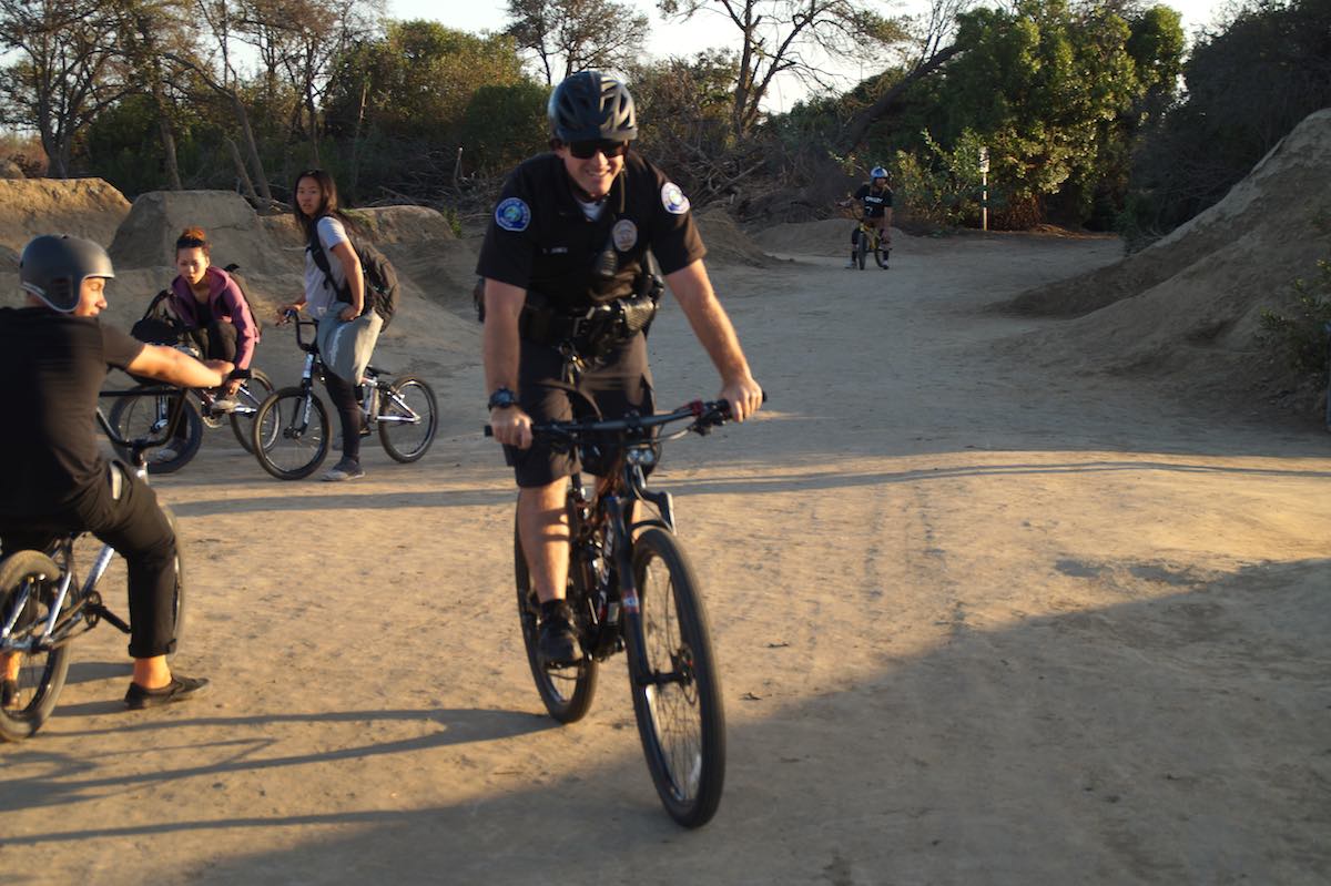 Costa Mesa police Officer Trevor Jones takes a short ride around Sheep Hills in Costa Mesa on a recent afternoon. (photo: Bradley Zint)