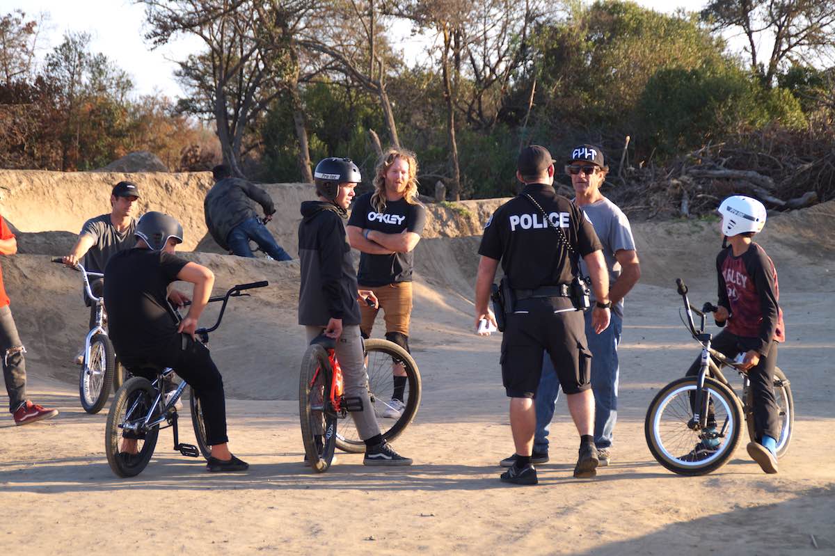 Costa Mesa police Officer Trevor Jones talks with some Sheep Hills riders and enthusiasts about the park. (photo: Bradley Zint)