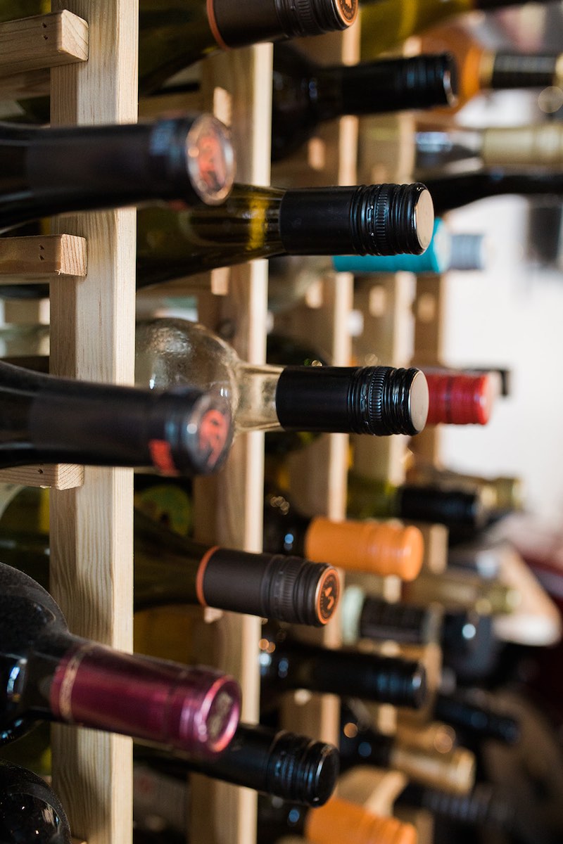 Wine rack full of wine bottles at InspiRED Art Wine Painting Studio and Wine Bar in Costa Mesa, California. (photo: Brandy Young)