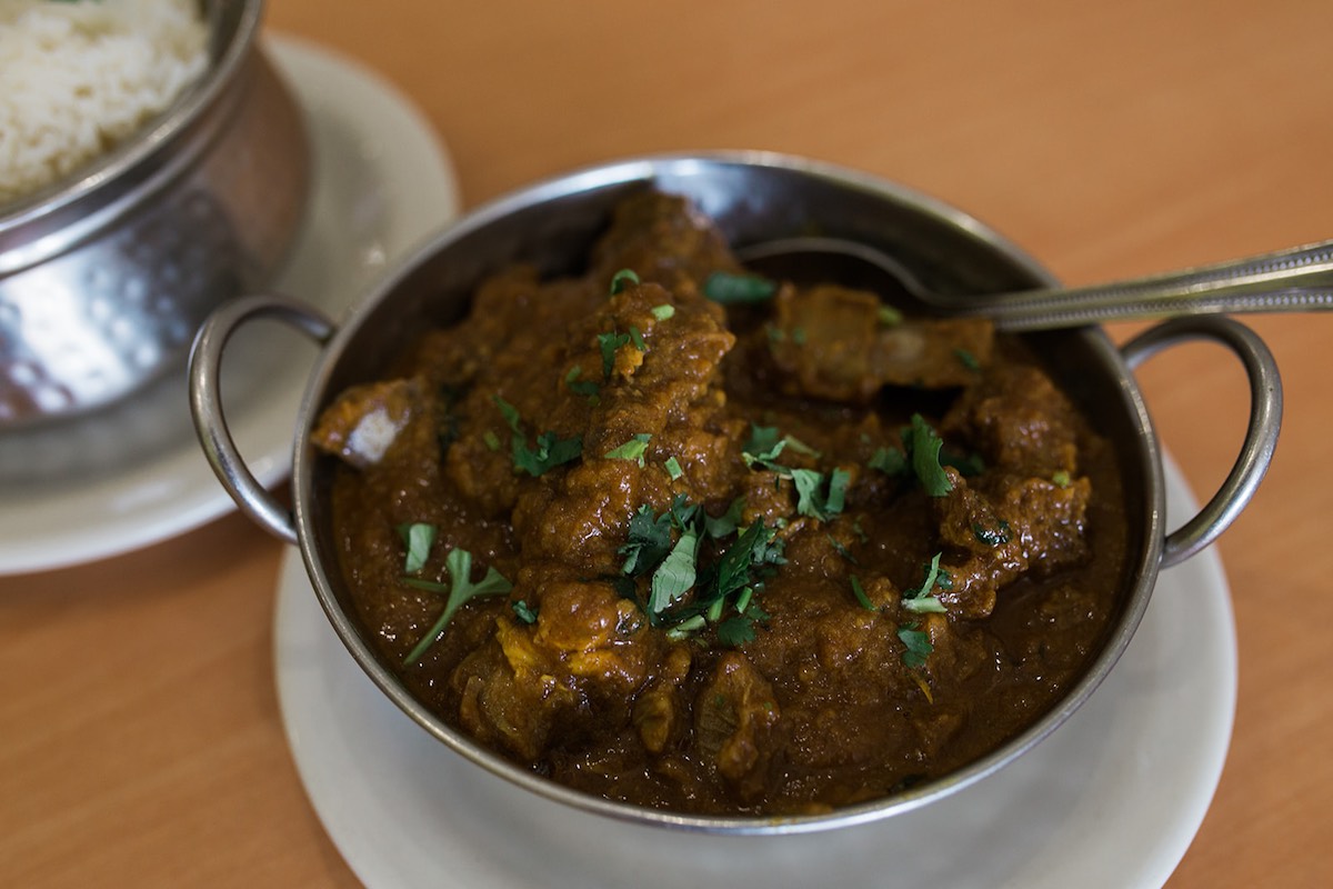 Tilak's most recommended dish: Goat Curry with tomatoes and spices served with rice. (photo: Brandy Young)