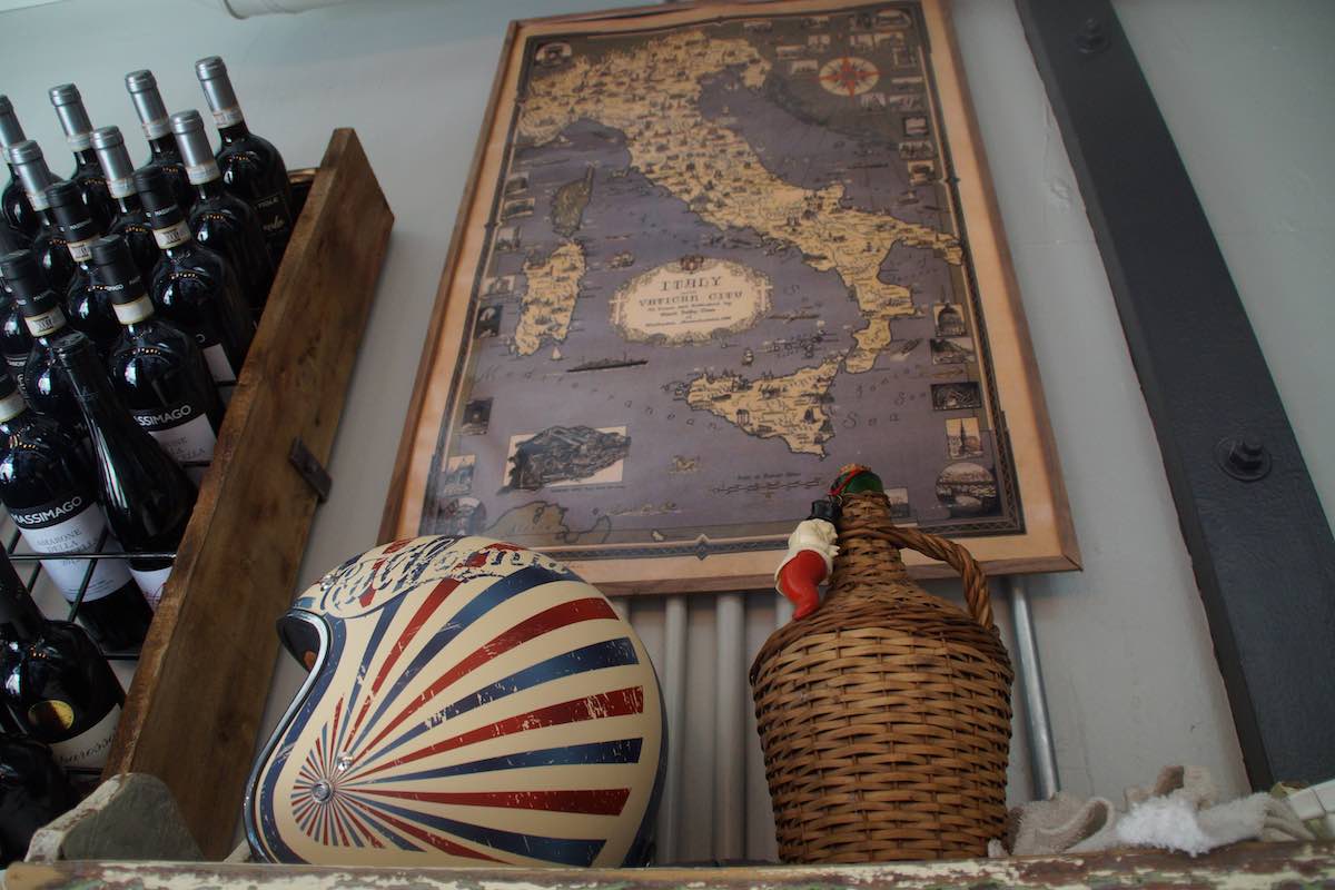 Map of Italy, and wine rack, at Trenta Pizza and Cucina at Midway Market in Westside Costa Mesa, Orange County, California. (photo: Bradley Zint)