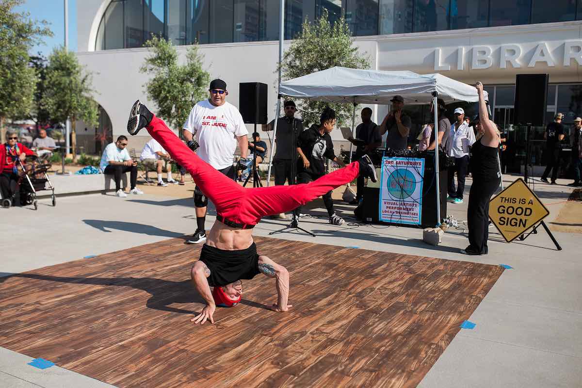 I Heart Costa Mesa: A breakdancer spins on his head at the first Costa Mesa ArtWalk at Lions Park in Costa Mesa, Orange County, California. (photo: Brandy Young)