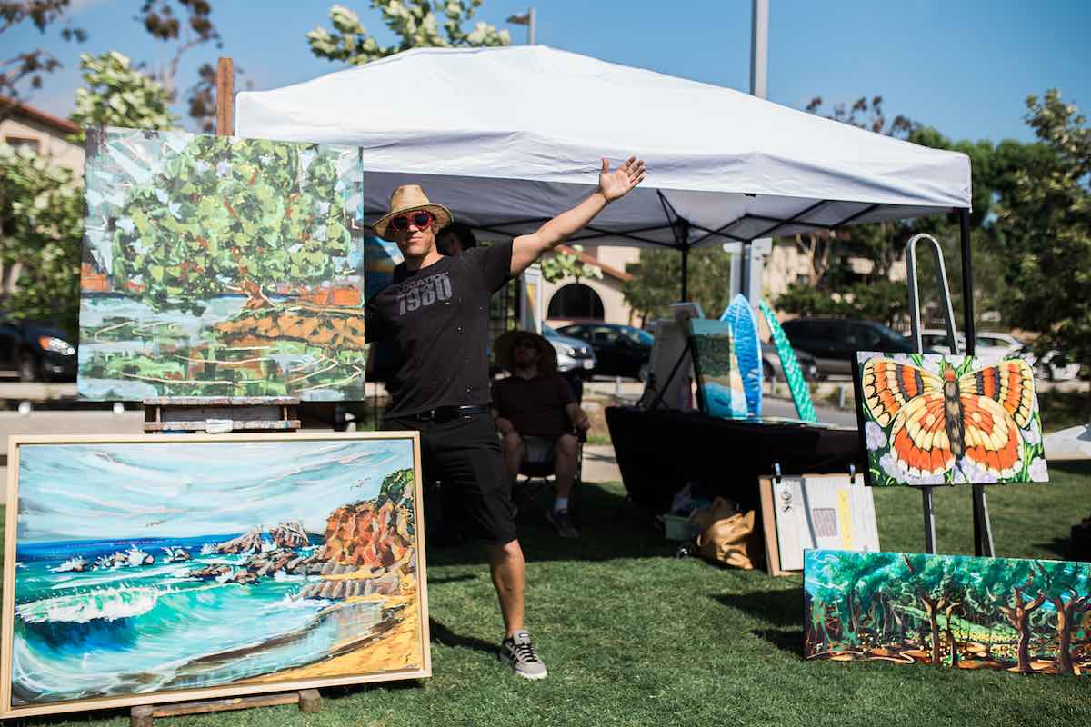 I Heart Costa Mesa: Artist and painter, Jesse Fortune of Location 1980, displays his paintings at the Costa Mesa ArtWalk at Lions Park in Costa Mesa, Orange County, California. (photo: Brandy Young)