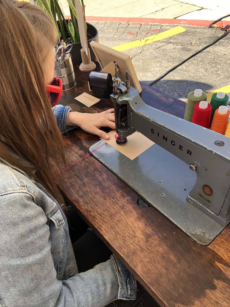 I Heart Costa Mesa: Sarah Jane Goodman works on a sarahjane goods chain stitched greeting card at the Fall In Love With The Westside event at Estancia High School in Orange County, California. (photo: Samantha Chagollan)