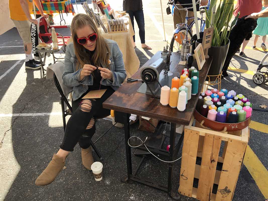 I Heart Costa Mesa: Sarah Jane Goodman works on a chain stitched greeting card at the Fall In Love With The Westside event at Estancia High School in Orange County, California. (photo: Samantha Chagollan)