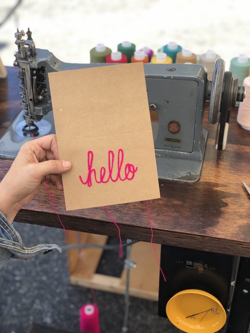 I Heart Costa Mesa: Sarah Jane Goodman shows off her embroidered, chain stitched 'hello' greeting card in Westside Costa Mesa, Orange County, California. (photo: Samantha Chagollan)