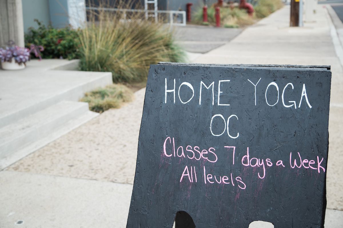 I Heart Costa Mesa: A Sandwich Board announcing classes for yogis at Home Yoga OC in Westside Costa Mesa, Orange County, California. (photo: Brandy Young)