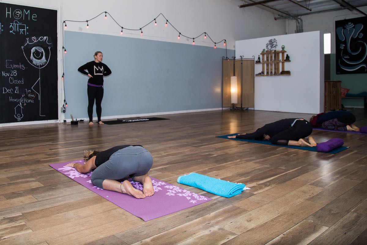 I Heart Costa Mesa: Yoga class, stretching, yoga mat, at Home Yoga OC in Westside Costa Mesa, Orange County, California. (photo: Brandy Young)