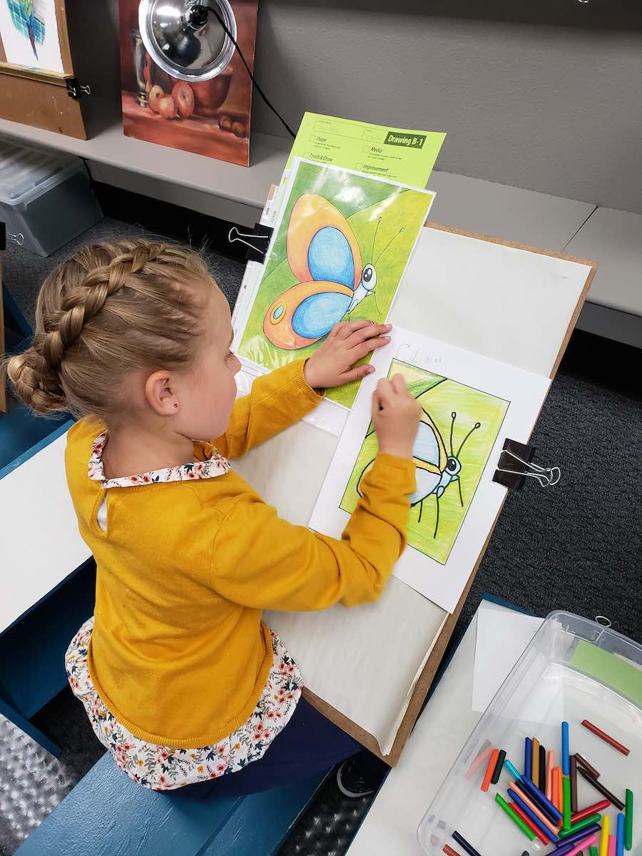 I Heart Costa Mesa: A young art student works on her drawing of a butterfly, at ArtSteps Costa Mesa in Orange County, California. (photo courtesy of ArtSteps)