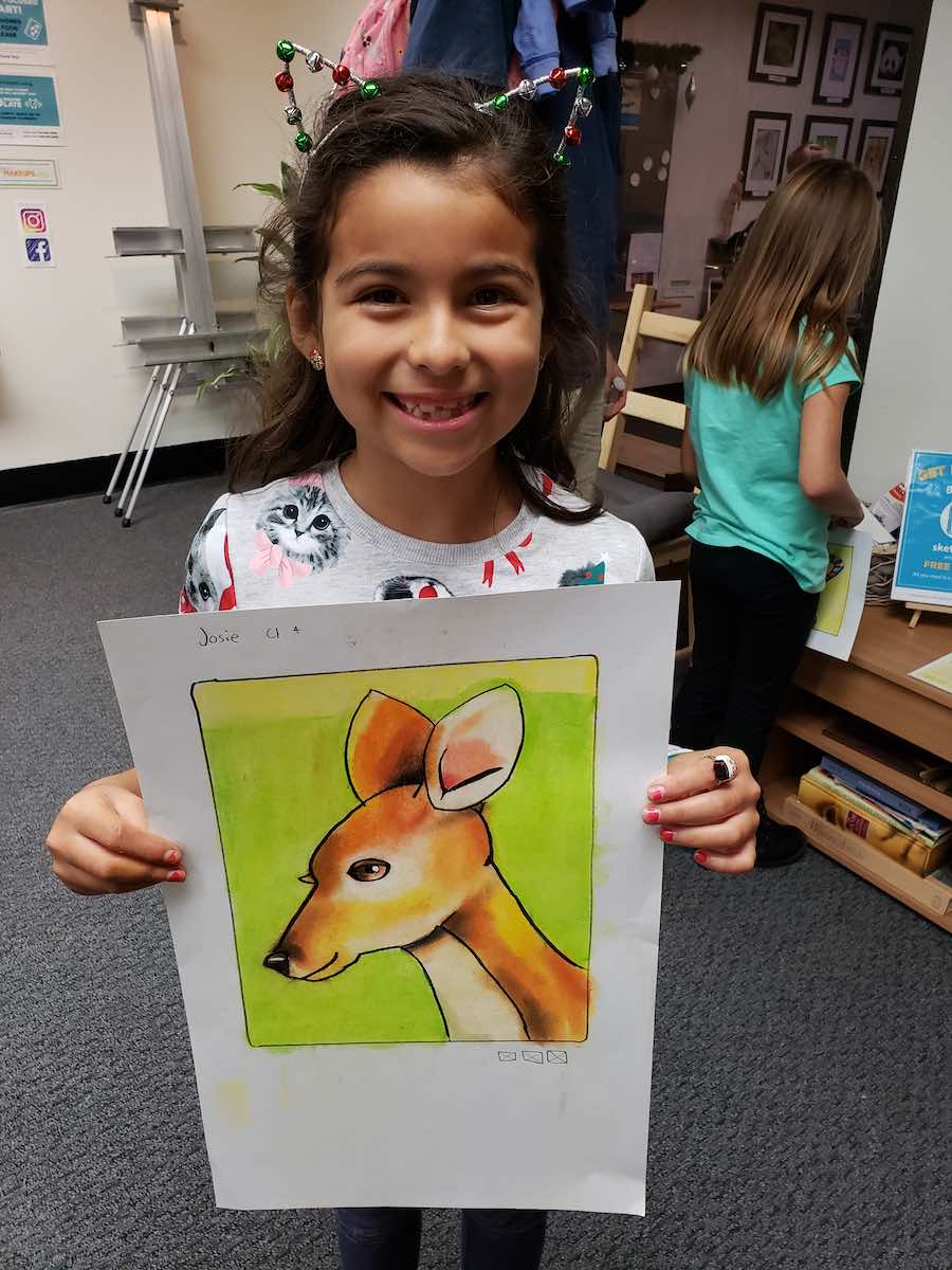 I Heart Costa Mesa: A young art student displays her pastel deer at ArtSteps Costa Mesa in Orange County, California. (photo courtesy of ArtSteps)
