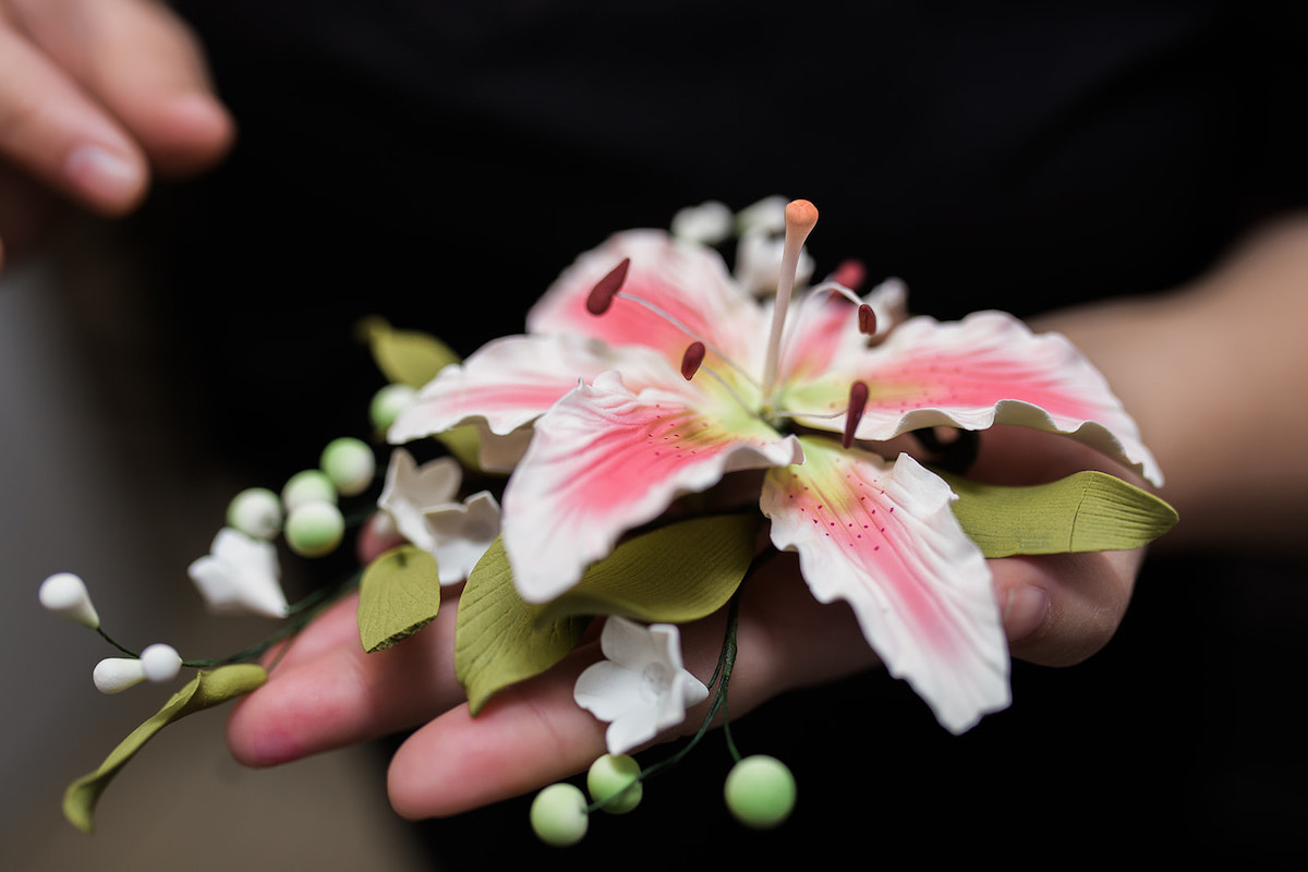 I Heart Costa Mesa: Baker and business owner, Joana Arenas, displays a floral cake topper at Arenas Dream Cakes in Westside Costa Mesa, Orange County, California. (photo: Brandy Young)